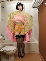 Mature slut in poodle skirt and stockings in the bathroom