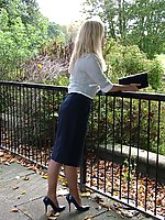 Blonde Milf teasing outdoors in a lovely pair of blue high heels and nylons